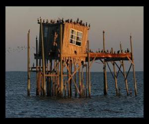 Puzzle Ξυλοπόδαρο σπίτι με καλύβα για τους αλιείς, που υποστηρίζονται για την κατασκευή πασσάλων στη λίμνη